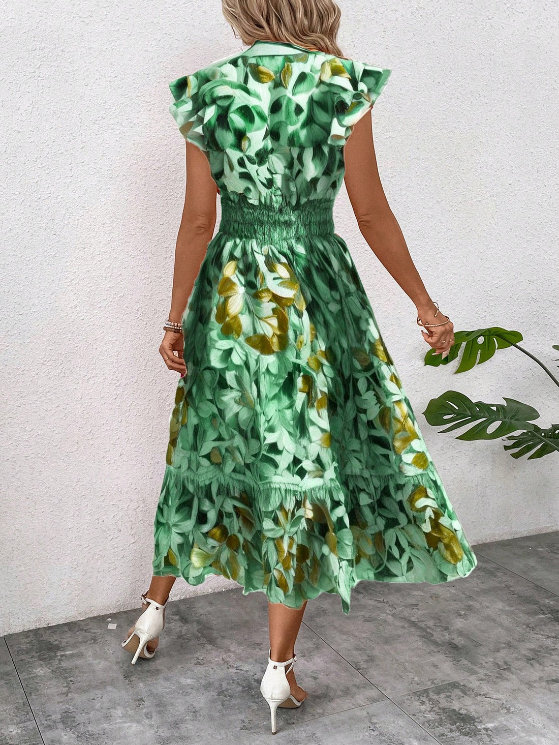 Embrace elegance and summer style with our V-neck floral maxi dress. Perfect for your next resort getaway, this dress boasts a flattering silhouette and a playful floral print. Be the envy of every fashionista in this statement piece.