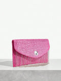 Back view of chic metallic coated straw woven clutch bag with chain and tassel - ideal for summer vacations with metallic finish, woven straw texture, woven texture for vacation styling