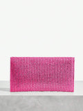 Close-up view of chic metallic coated straw woven clutch bag with chain and tassel - ideal for summer vacations with metallic finish, woven straw texture, woven texture for vacation styling