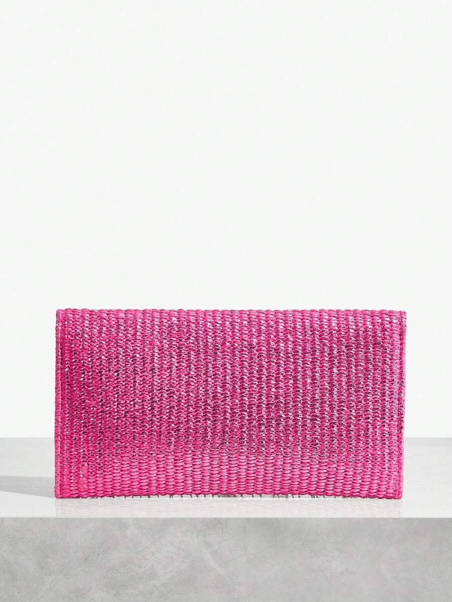 Close-up view of chic metallic coated straw woven clutch bag with chain and tassel - ideal for summer vacations with metallic finish, woven straw texture, woven texture for vacation styling