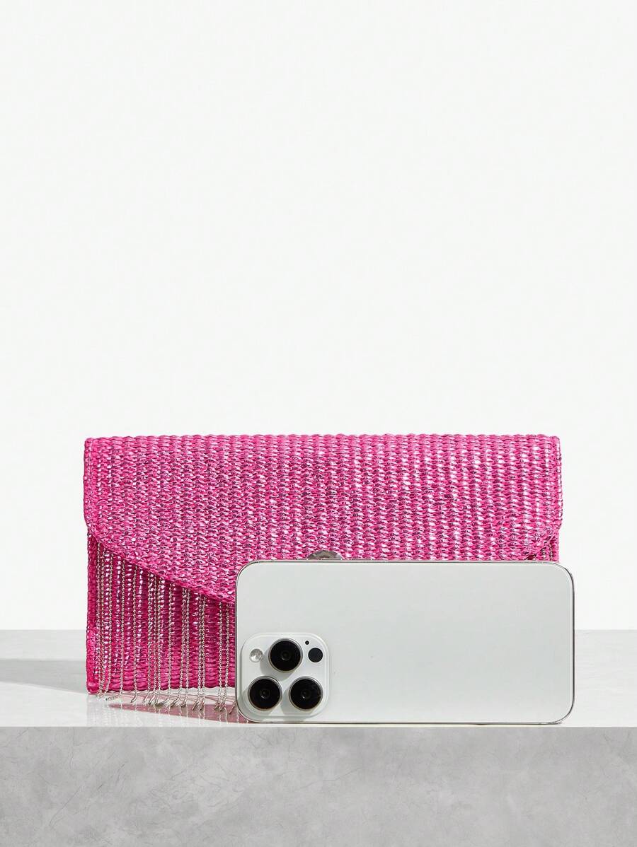 Close-up view of chic metallic coated straw woven clutch bag with chain and tassel - ideal for summer vacations with metallic finish, woven straw texture, woven texture for vacation styling