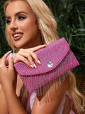 Close-up view of chic metallic coated straw woven clutch bag with chain and tassel - ideal for summer vacations with metallic finish, woven straw texture, woven texture for vacation styling