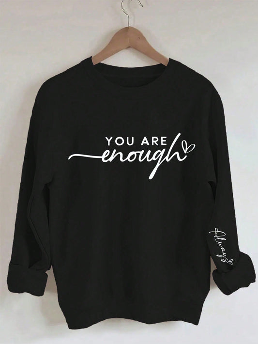 Step up your casual style with our Essence of Casual Comfort: Slogan Printed Long Sleeve Sweatshirt. Made with soft and cozy material, this sweatshirt features a stylish slogan print that adds a touch of personality to any outfit. Enjoy comfort and style in one with this must-have wardrobe staple.