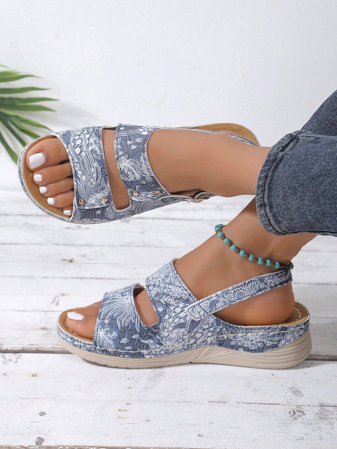 Add a touch of elegance to your outfit with these Peacock Pattern Wedge Sandals. Perfect for outdoor wear, they provide both style and comfort. Available in plus sizes, these sandals are a must-have for any fashion-forward woman. With a unique peacock pattern, they are sure to make a statement.