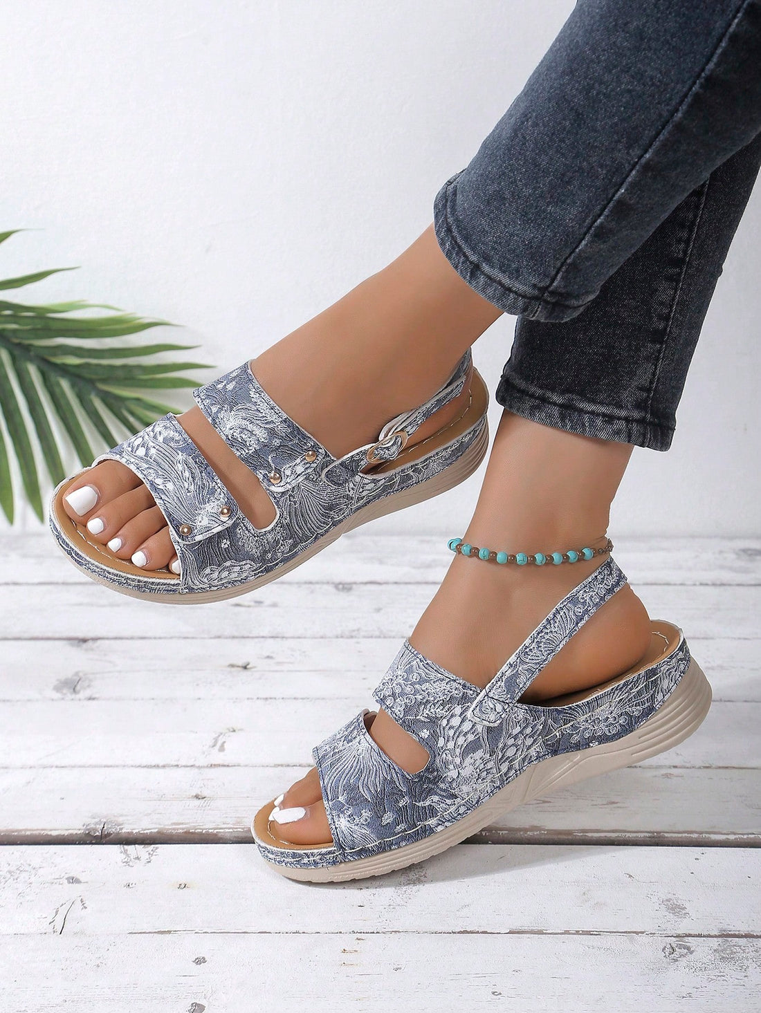 Add a touch of elegance to your outfit with these Peacock Pattern Wedge Sandals. Perfect for outdoor wear, they provide both style and comfort. Available in plus sizes, these sandals are a must-have for any fashion-forward woman. With a unique peacock pattern, they are sure to make a statement.