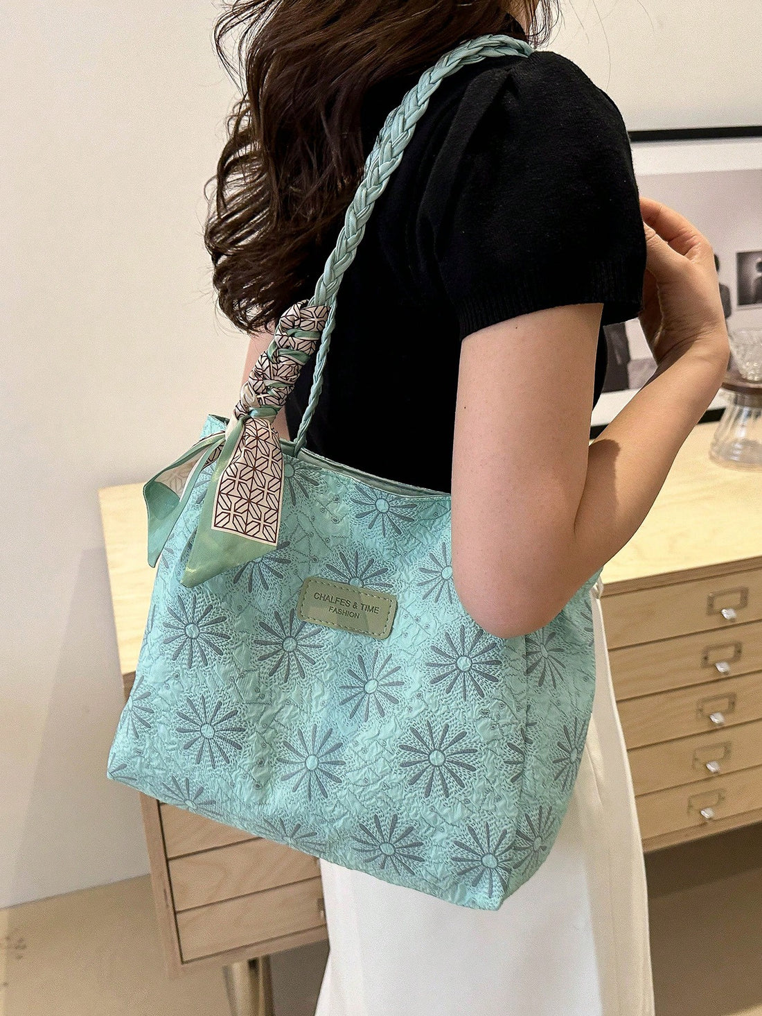 Experience ultimate convenience and style with our versatile Stylish Green Printed Shoulder Tote. Designed specifically for the modern woman on the go, this bag offers ample storage for all your essentials, while the eye-catching print adds a touch of personality to your look.
