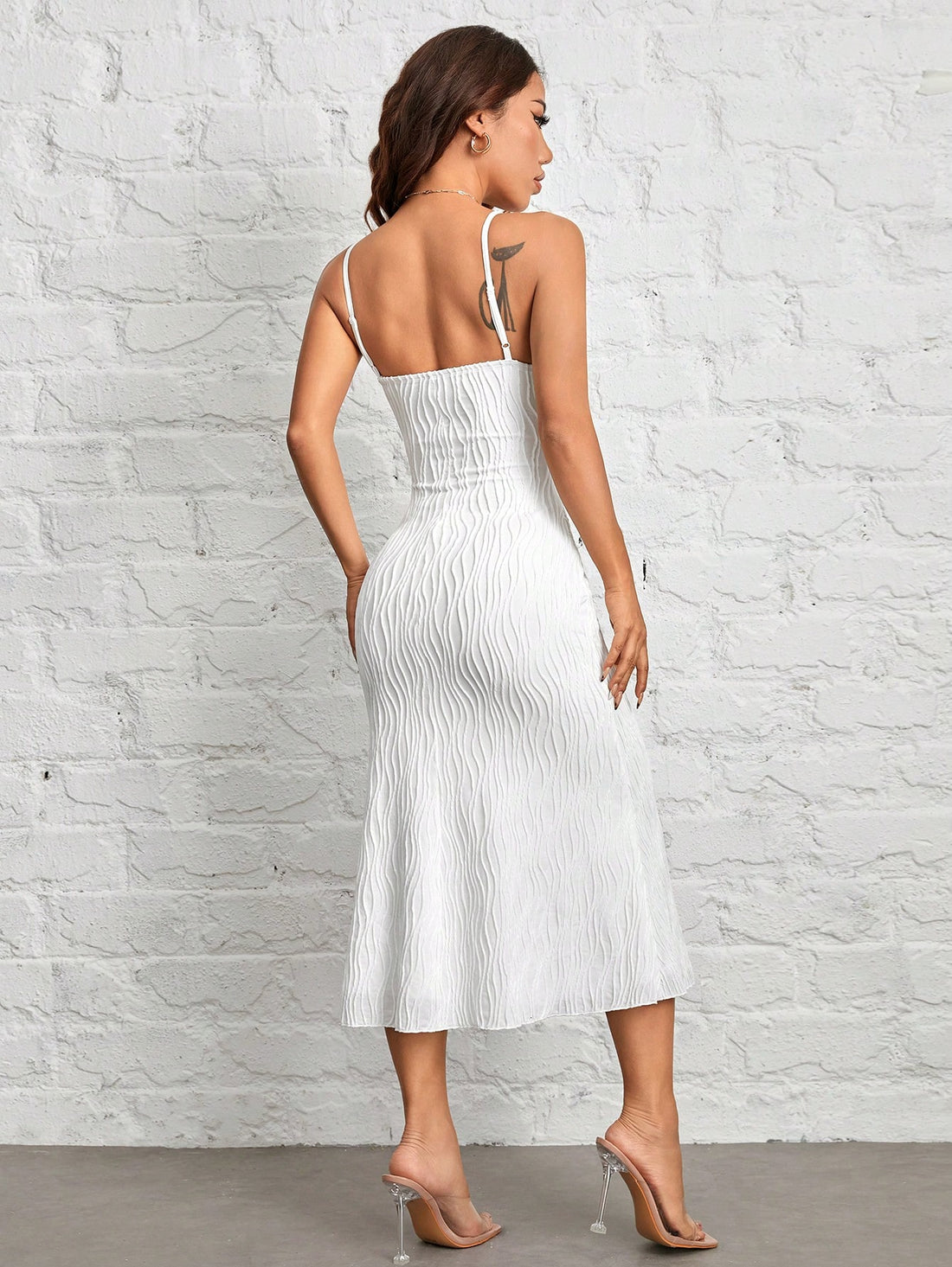 This Chic White Fuzzy Textured Long Cami Dress is perfect for petites, offering a stylish and comfortable option for your wardrobe. The fuzzy texture adds a touch of sophistication, while the long length provides a flattering silhouette. Perfect for any occasion, this dress is a great addition to your collection.