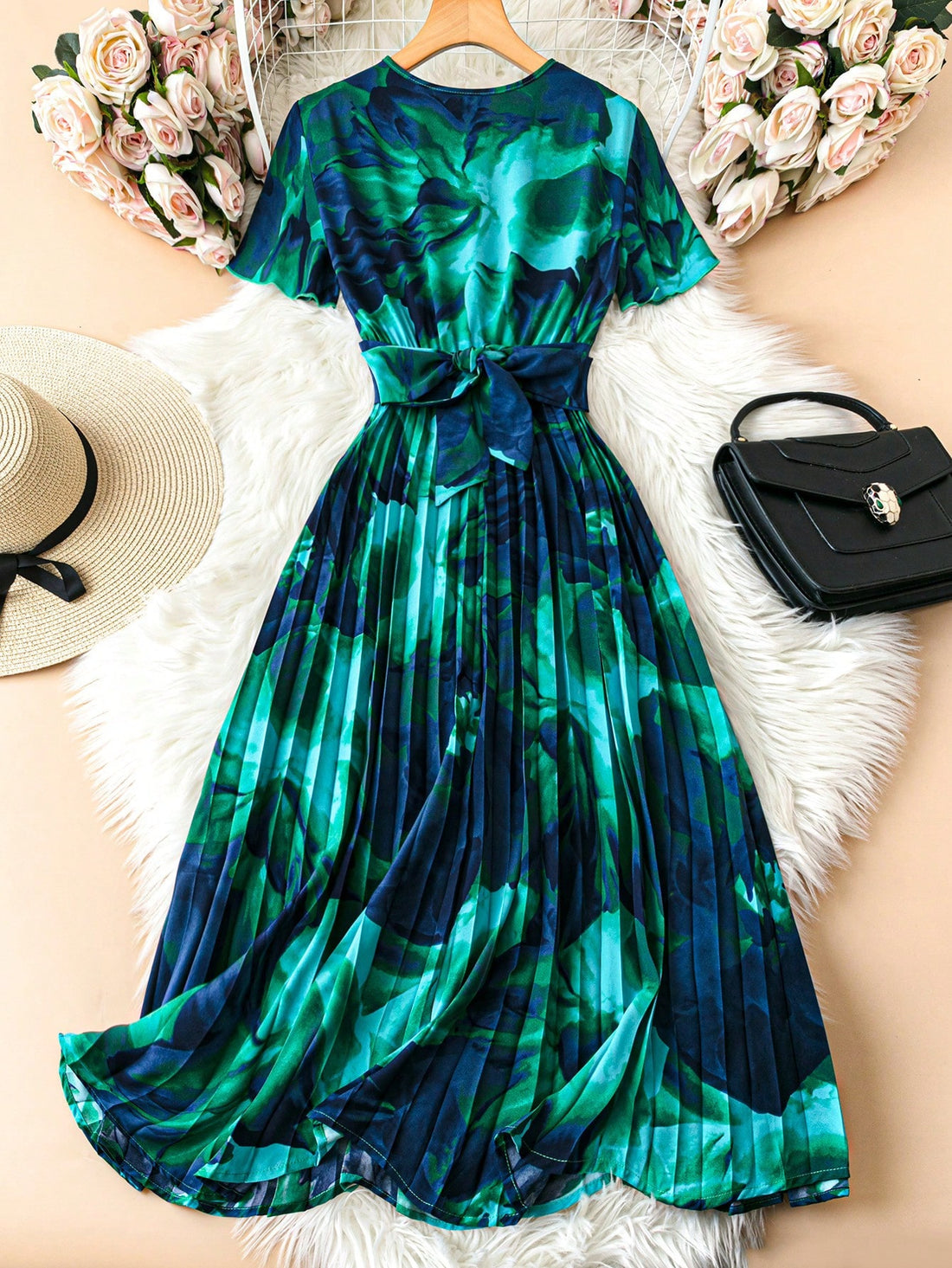 Stand tall and stand out in our Elegant Summer Maxi Dress for Tall Women! With a stunning floral print, ruffle sleeves, and a bow tie belt, this dress is perfect for any occasion. Stay comfortable and stylish all summer long. Good luck finding a dress as elegant and fun as this (we'll wait)!