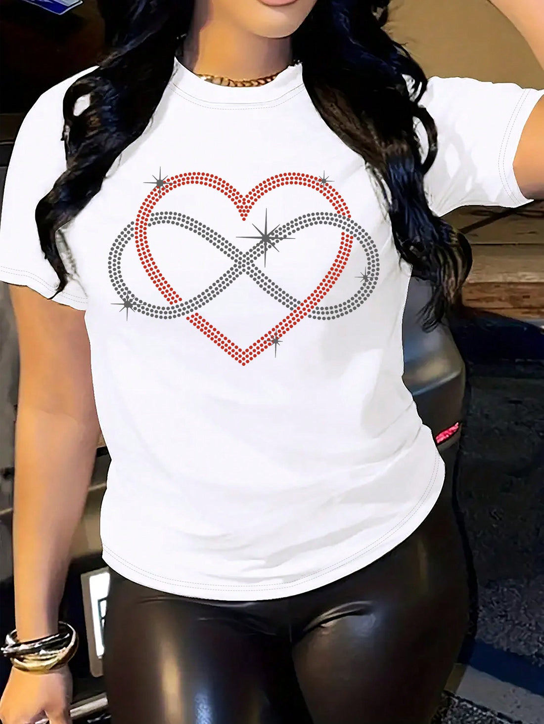Elevate your style with the Heartfelt Glamour T-Shirt. Adorned with rhinestone-embellished heart patterns, this tee adds a touch of glamour to any outfit. Crafted for women who want to make a statement, it's the perfect combination of comfort and sophistication. Stand out with the Heartfelt Glamour T-Shirt.