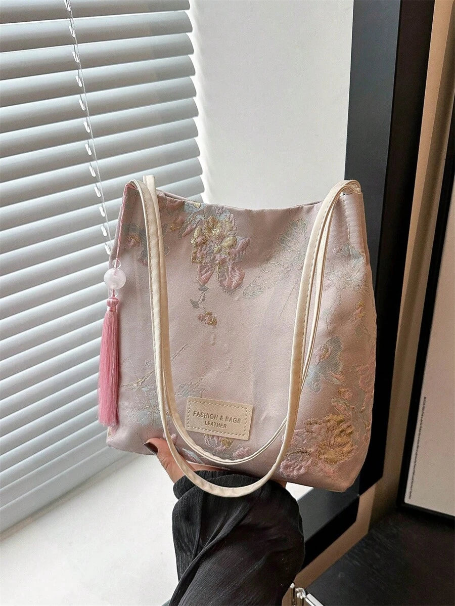 Effortless style meets everyday practicality with this chic vintage canvas crossbody bag. Crafted from durable 100% polyester canvas, this medium-sized bucket bag features a striking tie-dye pattern in soft pink tones that adds a retro flair to any outfit. Perfect for shopping trips and casual outings, the bag combines minimalist design with functional details. 