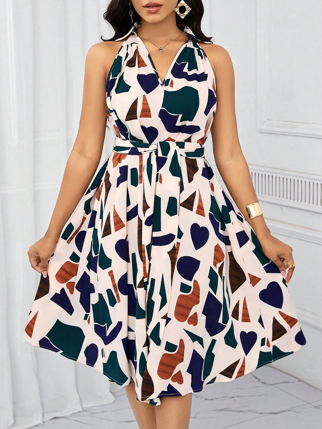 Step out in style this summer with our Chic Geometric Print Bow-Waist Dress. With a playful geometric print and a flattering bow-waist design, this dress effortlessly combines elegance with fun. Perfect for any summer occasion, this dress is sure to make you stand out in a crowd.