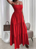 Red smocked tiered maxi sundress with thin straps and flowy skirt