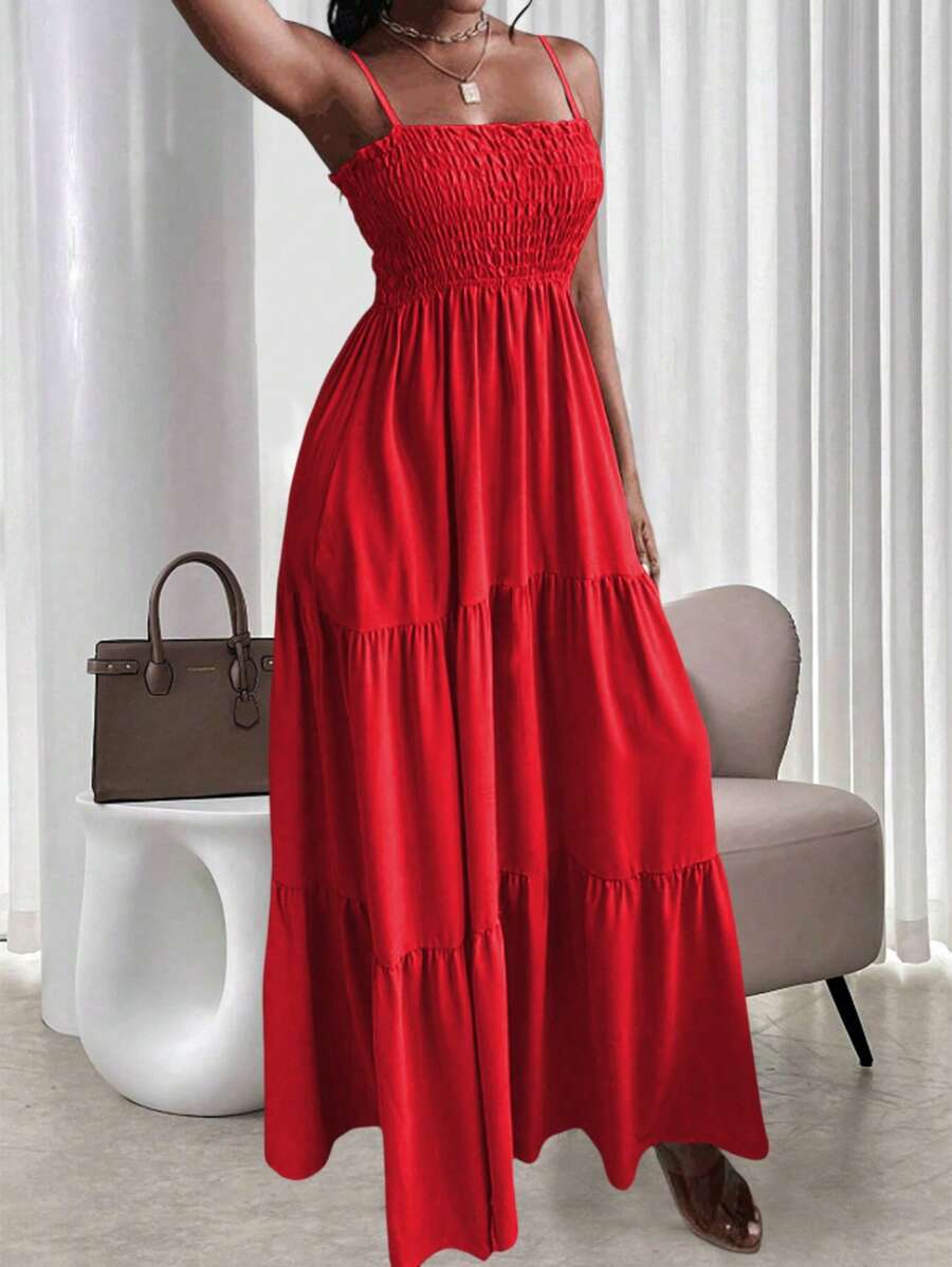 Red smocked tiered maxi sundress with thin straps and flowy skirt
