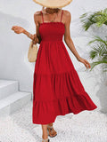 Red smocked bodice tiered maxi sundress with A-line silhouette