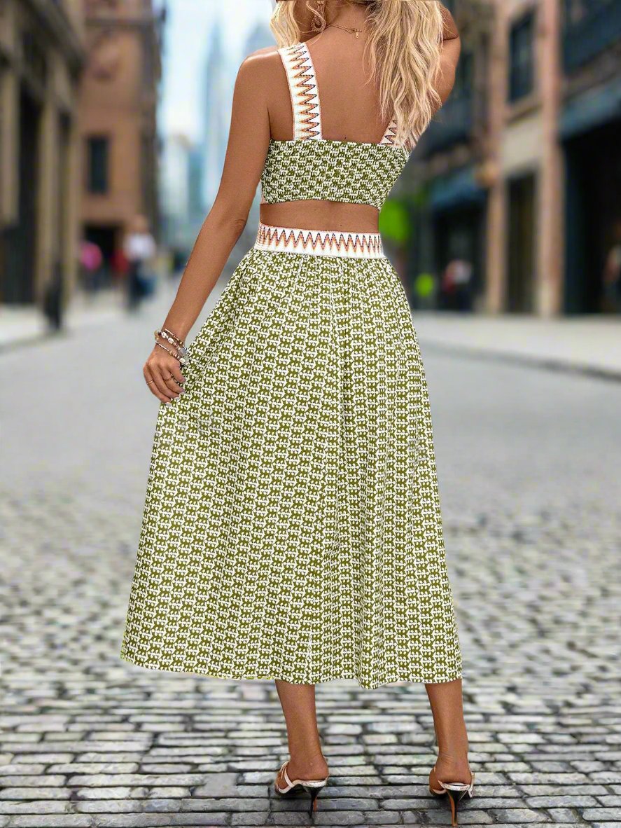 Expertly crafted with a patchwork printed design and a woven belt, this holiday dress exudes elegance. The unique hollow out sleeveless design adds a touch of sophistication, while providing a flattering silhouette. Perfect for any holiday event, this dress is sure to make a statement.