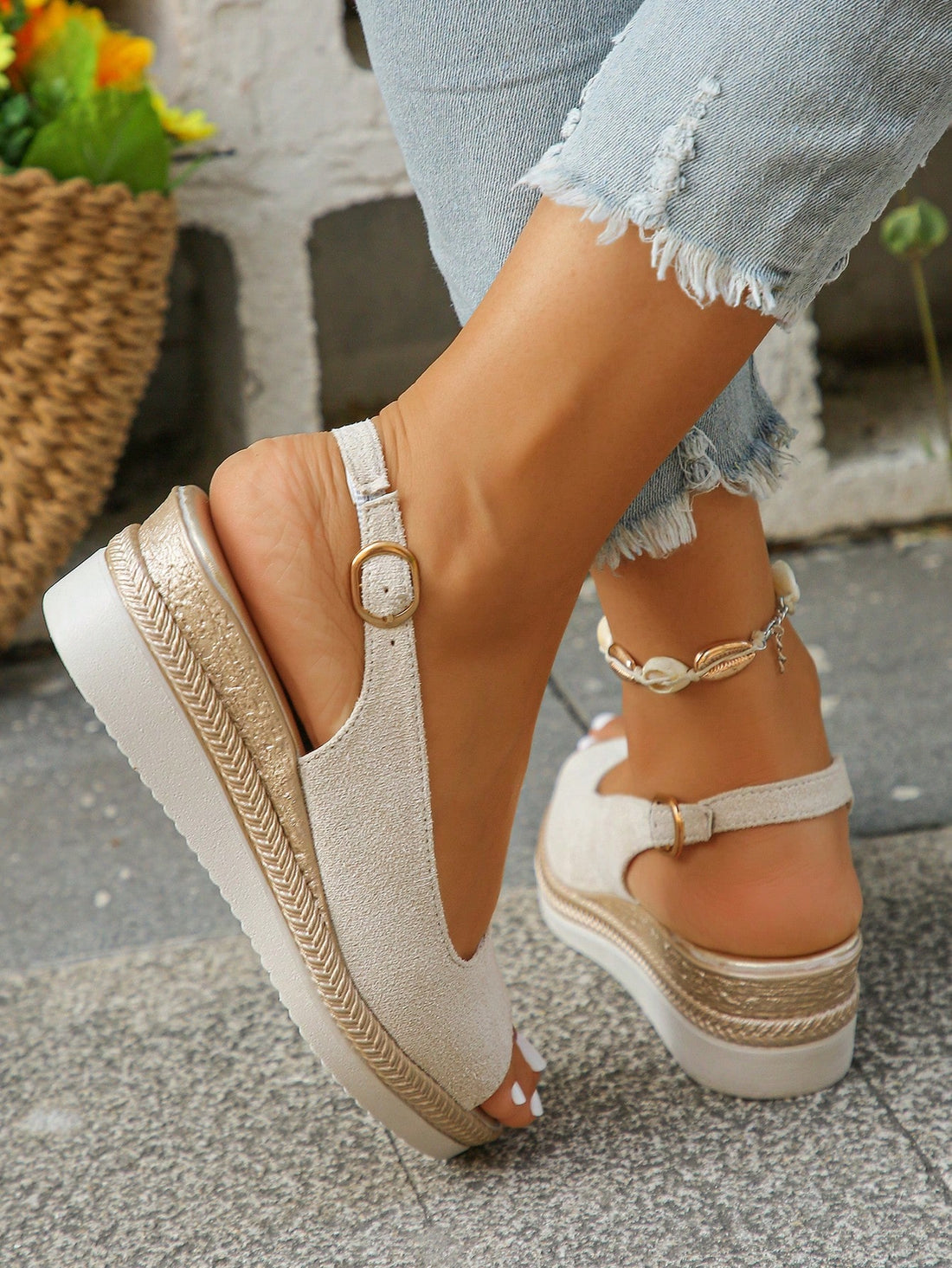 Elevate your summer style with these chic beige peep-toe wedge sandals. Designed for stylish middle-aged women, they feature gold accents that add a touch of glamour. Perfect for any occasion, these sandals will keep your feet comfortable and fashionable all day long.