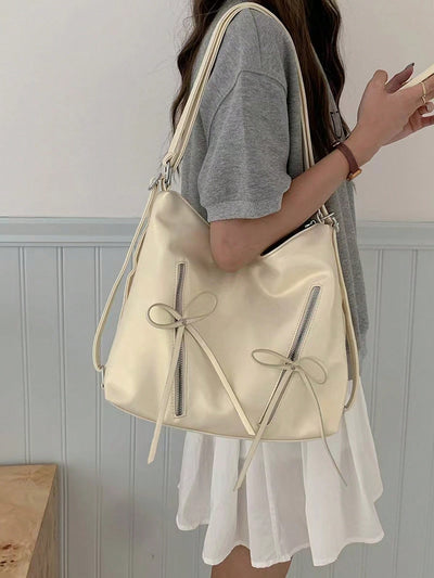 Elevate your style with our Chic Bow Knot Backpack. This fashionable Korean tote bag is perfect for daily adventures. With its unique bow knot design, it adds a touch of sophistication to any outfit. Lightweight and spacious, it's the ultimate accessory for both fashion and function.