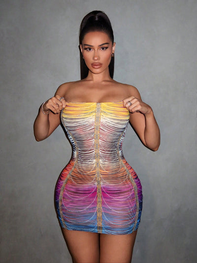 Shine bright and turn heads in our Rainbow Rhinestone Mesh Bodycon Dress! The perfect summer party outfit, this dress features sparkling rhinestones and a body-hugging fit. Stay stylish and comfortable all night long.