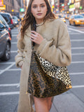 Make a statement with our Chic Leopard Print Shoulder Bag. Crafted with trend-setting design, this bag is the ultimate fashion accessory. Featuring a fierce leopard print, it adds a touch of style to any outfit. Expertly made with quality materials, it's both fashionable and functional. Elevate your look with this must-have bag.