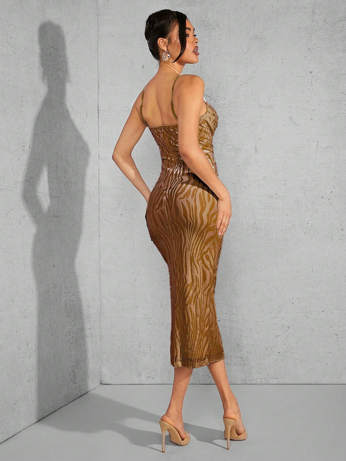 Discover the perfect combination of fashion and style with our Chic Zebra-Striped Cami Dress. The unique split thigh detail adds a touch of elegance, while the zebra stripes create a fierce and bold statement. Step out in confidence and turn heads with this must-have dress.