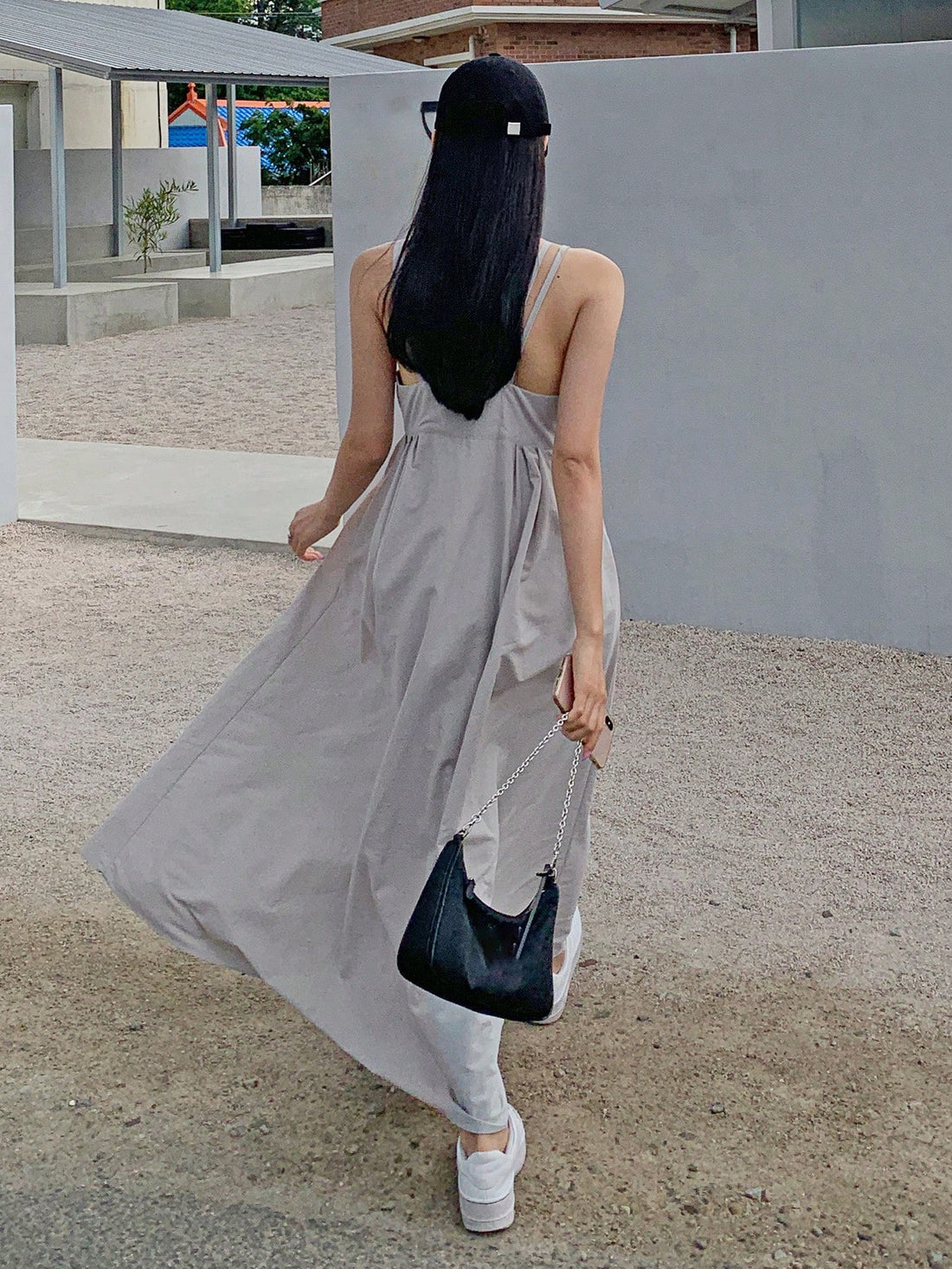 Effortlessly elegant and comfortable, this Women's Backless Long Cami Dress is a must-have for any wardrobe. With built-in bust support, you can confidently wear this backless dress without the hassle of a bra. Perfect for any occasion, this dress combines style and practicality for a truly effortless look.