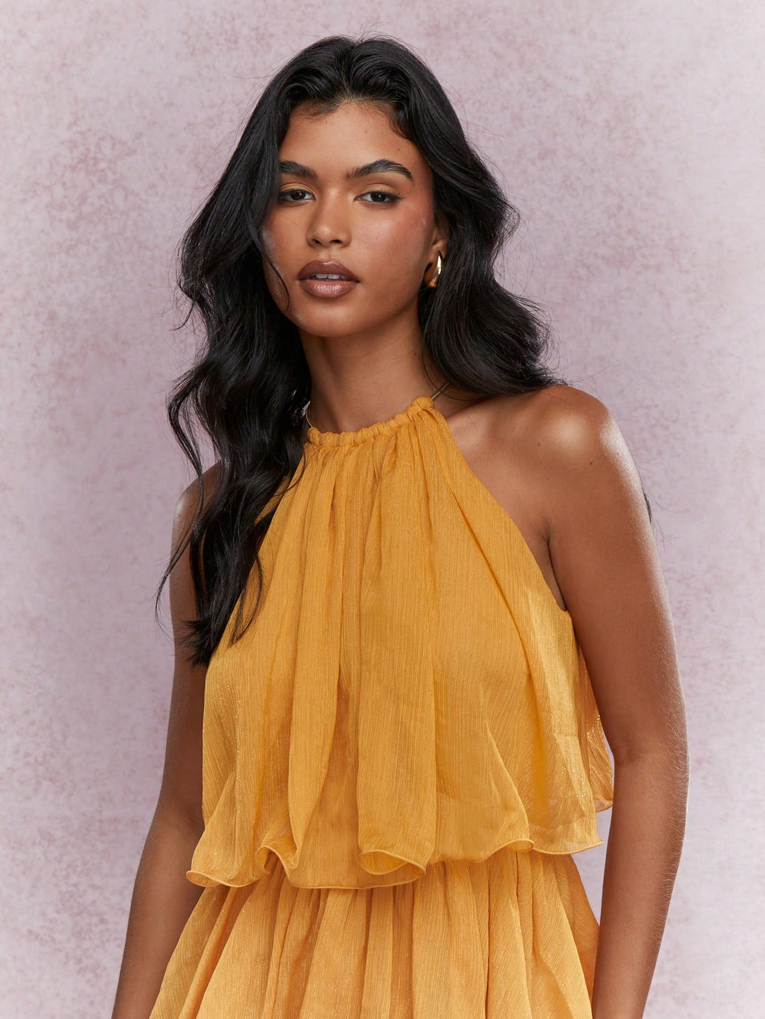 Effortlessly exude elegance in our Chic Tiered Ruffle Halter Neck Mini Dress. The tiered ruffle design and halter neckline create a chic and stylish look. Perfect for any occasion, this dress is the epitome of effortless elegance.