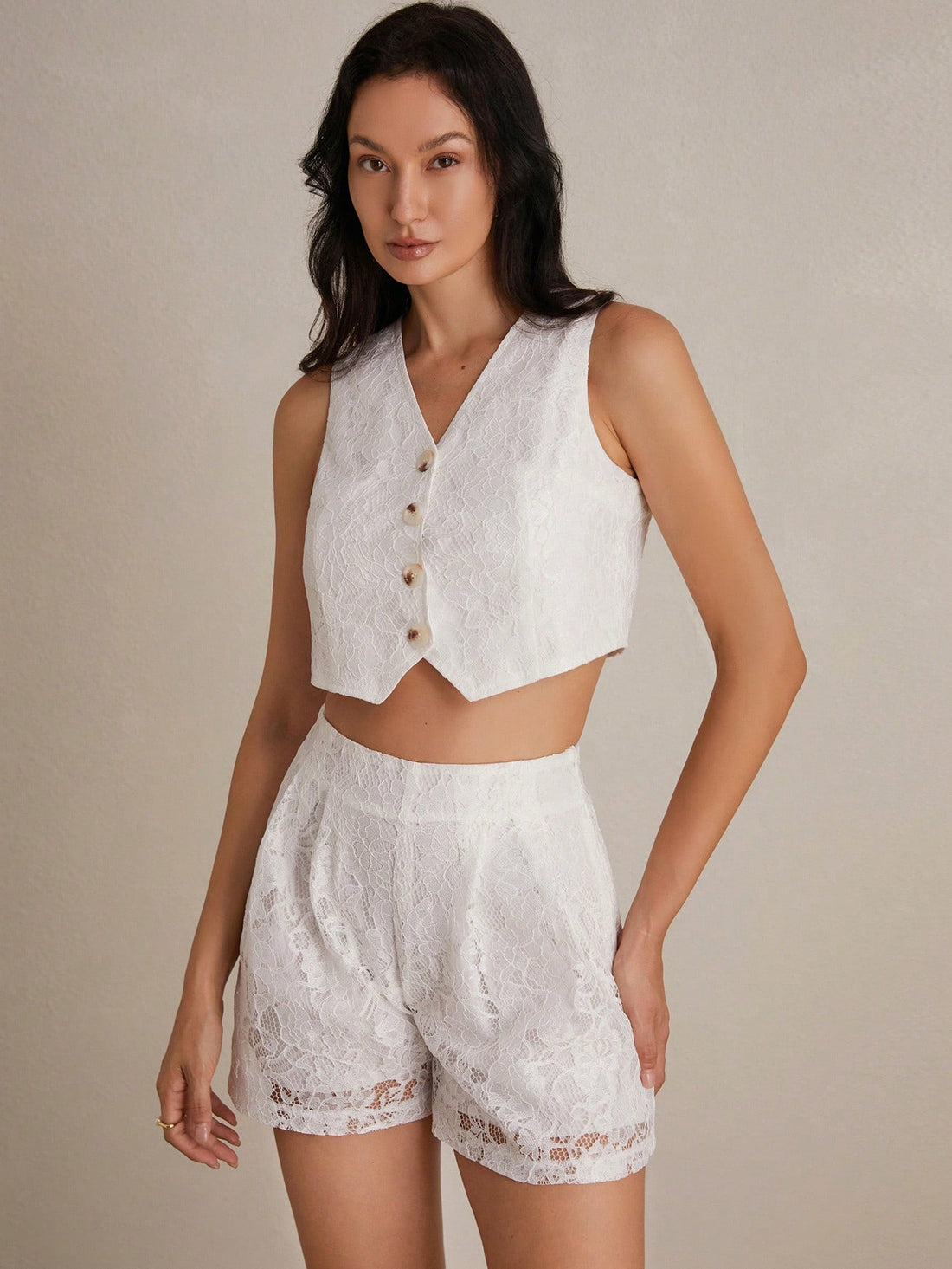 Embrace that effortless French Riviera vibe with this charming lace crochet shorts set. The sleeveless silhouette and flattering V-neckline keep things breezy and chic, while the delicate A-line cut skims beautifully over your curves. Perfect for lazy summer days, beachside strolls, or those moments when you want to look put-together without trying too hard. Mix textures, layer with a linen shirt, or let it shine solo—this set is your new go-to for relaxed elegance that feels anything but basic.
