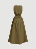 Back view of army green sleeveless dress with center zipper seam