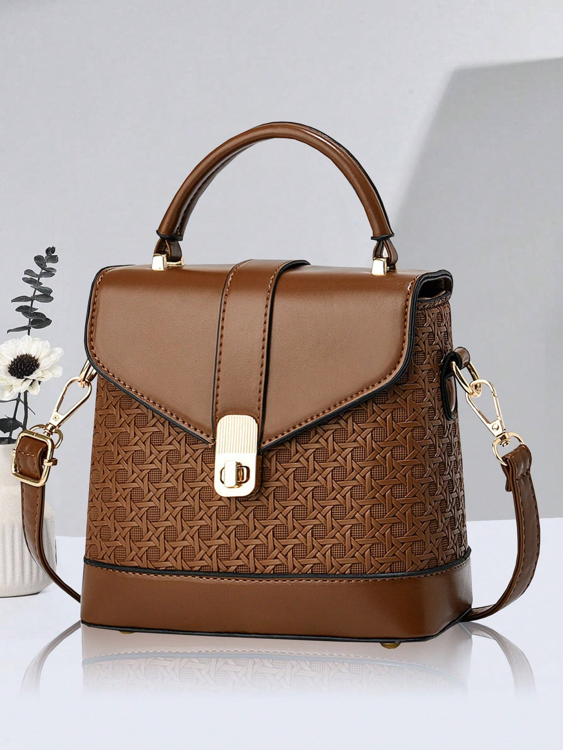 This Chic Box Shaped Shoulder Bag is an excellent Valentine's Day gift for the special woman in your life. Its unique box shape adds a touch of sophistication to any outfit, while the spacious interior and adjustable strap provide functionality. Made with quality materials, this bag is both durable and stylish. Perfect for the fashion-forward and practical woman.