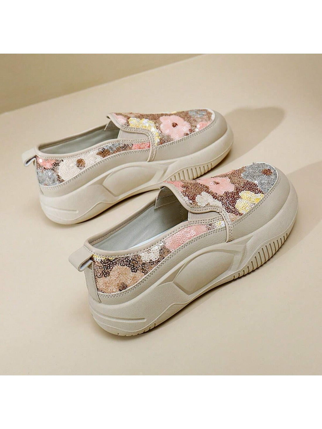 Benefit from effortless style with our Sparkling Floral Slip-On Sneakers. These slip-on sneakers feature a sparkling floral design that adds a touch of glamour to any outfit. The slip-on style allows for easy on-and-off, making them perfect for busy days and on-the-go activities. Elevate your style with these chic and comfortable sneakers.