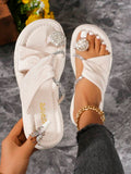 White platform rhinestone slide sandals with thick molded sole and crossover straps