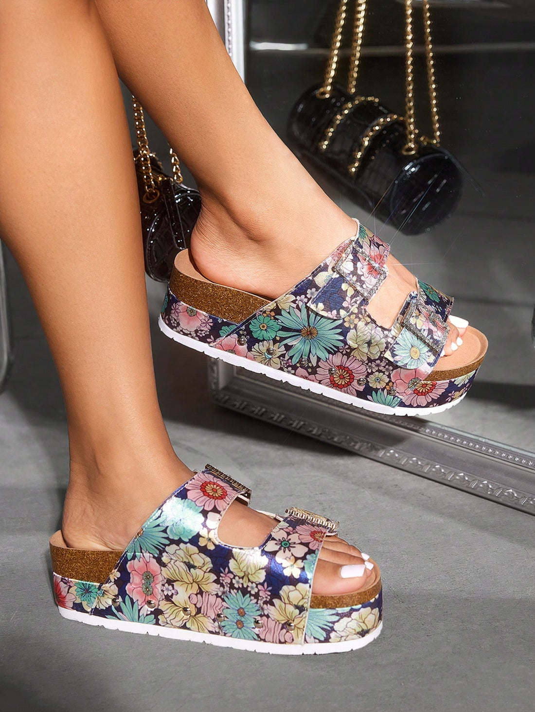 These trendy wedge sandals feature colorful floral straps, offering chic comfort for any occasion. The unique design adds a touch of style to any outfit, while the wedge provides added support and comfort. Perfect for everyday wear or special events. Elevate your wardrobe with these must-have sandals.