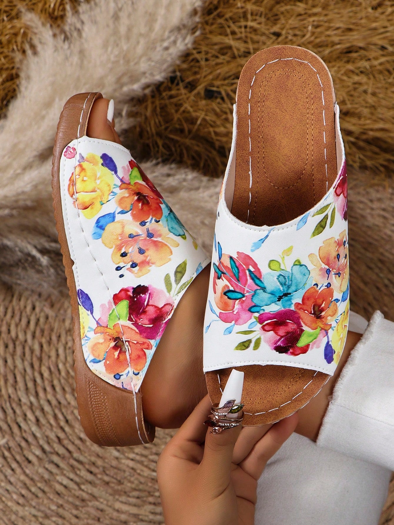 Elevate your summer style with our Chic Floral Printed Flat Sandals. Featuring a stylish and trendy floral print, these sandals are the perfect addition to any outfit. The flat design provides all-day comfort, making them a must-have for your summer wardrobe.