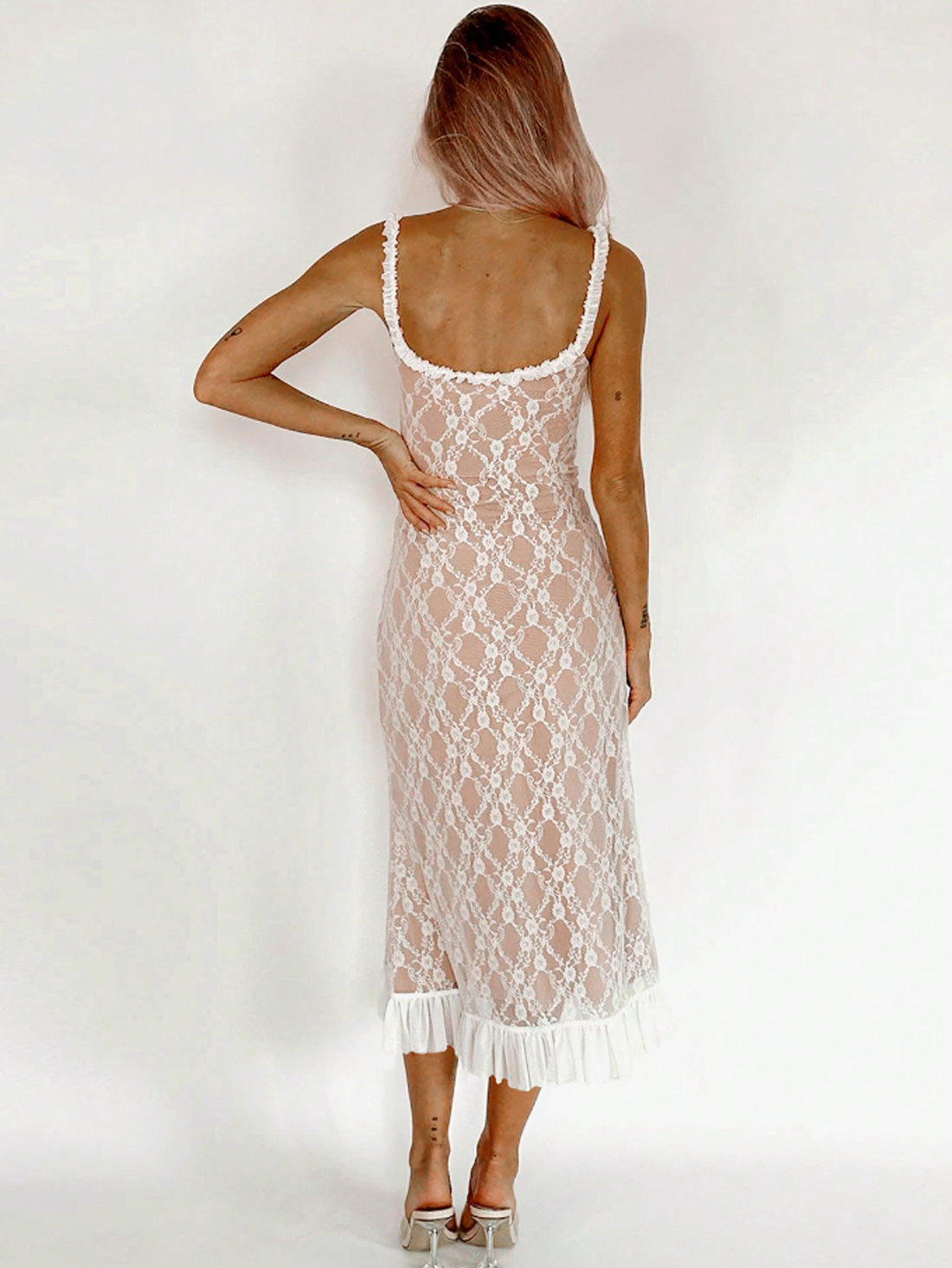 Elevate your summer wardrobe with our Luxe Lace Ruffle Slip Dress. Made with high-quality lace, this dress exudes elegance and sophistication. The delicate ruffle details add a touch of femininity to the design, making it perfect for any summer occasion. Upgrade your style today with this must-have dress.