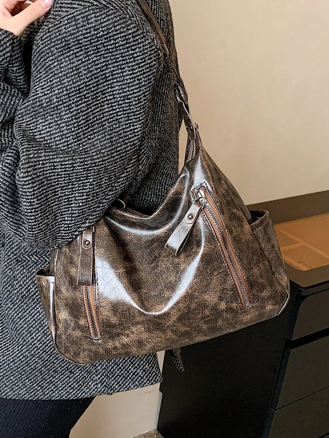 This chic shoulder tote is perfect for beach, shopping, and travel. Its versatile functionality allows you to carry all your essentials while still looking stylish. With its durable design and spacious compartments, this tote is a must-have for any fashion-forward traveler.