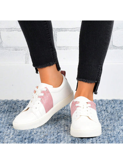 These Chic Lace-Up Sneakers for Women combine sleek style with comfort. The two-tone design adds a touch of uniqueness, while the lace-up closure ensures a secure fit. Made for active women who value both quality and fashion, these sneakers are perfect for any casual occasion.