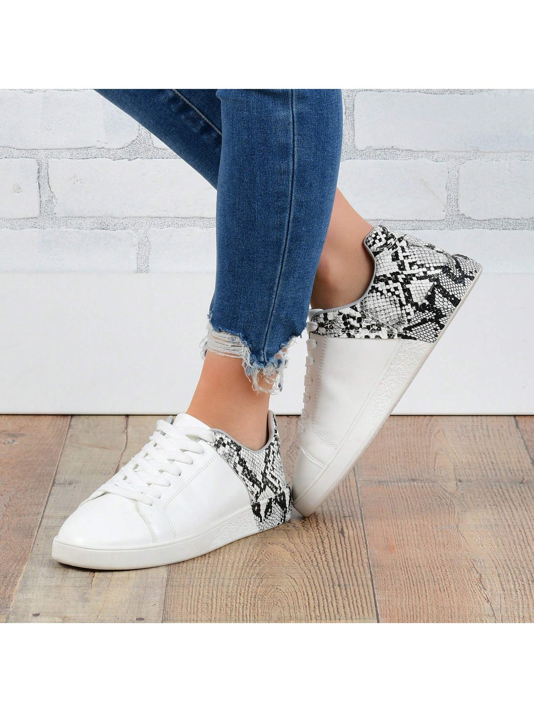 Stay comfortable and fashionable in Lace Up in Style: Women's Sneaker. Featuring a chic lace-up design, these sneakers offer both style and comfort in one shoe. The perfect choice for any outfit, these sneakers provide the best of both worlds.