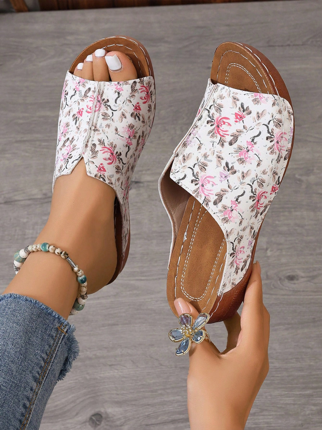 Experience ultimate comfort and style with our Women's Floral Detail Soft Sole Sandals. Made with ultra-light materials, these sandals are perfect for both vacation and outdoor activities. The floral design adds a feminine touch while providing maximum support for your feet. Enjoy every step without compromising on fashion.