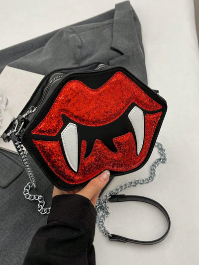 This Red Glittery Vampire Lips Crossbody Handbag is both spooky and stylish. Its vibrant red glitter design and vampire lips shape make it a stand-out accessory. Stay organized and hands-free with its crossbody strap, perfect for any Halloween or Gothic-inspired look.