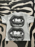 Front flat lay of heather grey gothic T-shirt with black stacked lips graphic
