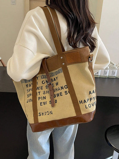 This letter print canvas tote offers a large capacity for all your shopping and commuting needs. With its durable canvas material and stylish design, this tote is perfect for casual use. Stay organized with ease and make a statement wherever you go.