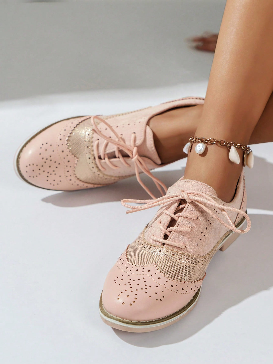 Step into style with Pretty in Pink: Women's Patchwork Design Brogue Oxford Shoes. Featuring a unique patchwork design, these oxfords effortlessly blend fashion and function. Crafted with comfort in mind, they are perfect for any occasion, adding a touch of sophistication to your wardrobe. 