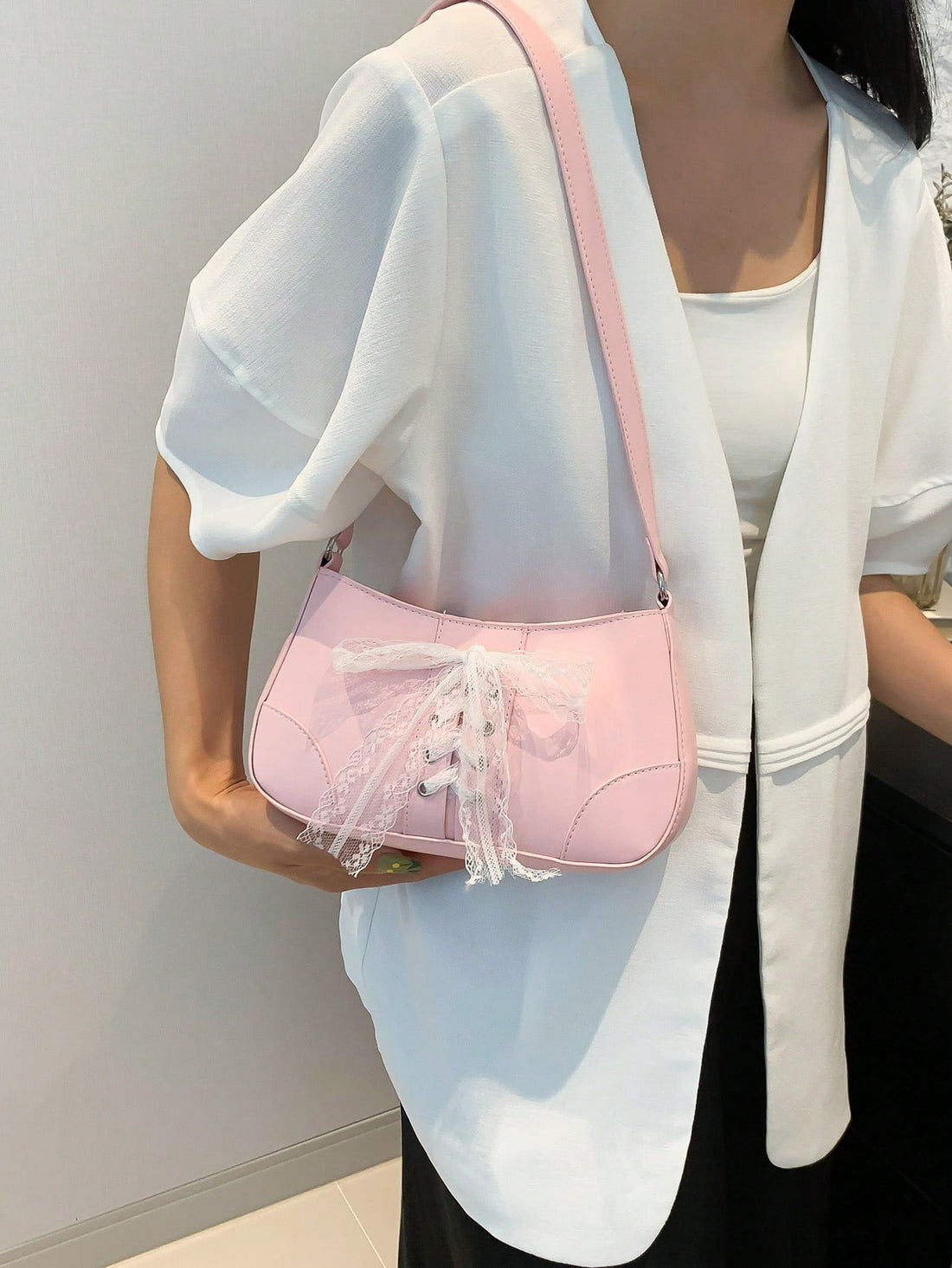 Introducing the Sweet Bowknot Handbag, a unique lace shoulder bag perfect for fashionable girls. With its charming bowknot design and delicate lace material, this handbag is sure to make a statement. Stay stylish while carrying all your essentials with ease.