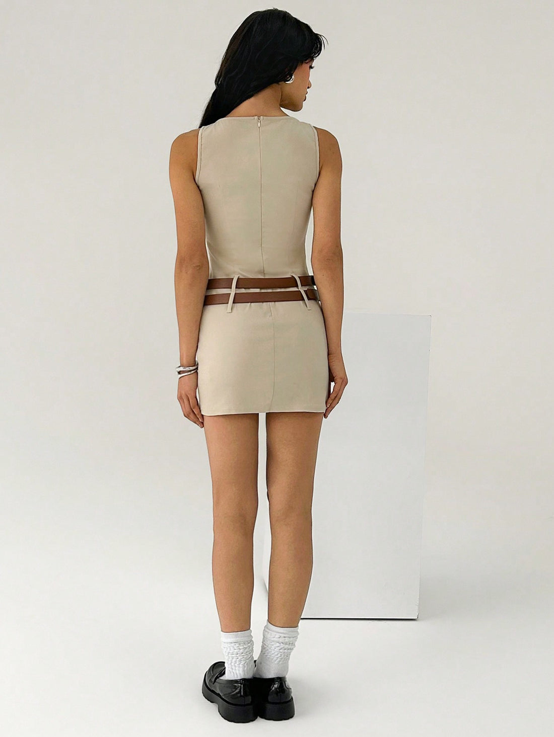 Step into summer with this chic slim fit sleeveless dress that hugs your silhouette just right. The included belt adds a flirty touch while defining your waist for an effortlessly stylish look. Perfect for sunny days and casual outings, this dress keeps you cool and confident all day long. Playful, polished, and ready to turn heads!