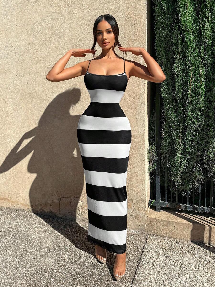 Turn heads this season in our effortlessly chic striped maxi dress—the perfect companion for sun-soaked getaways and breezy adventures. The flattering halter neckline frames your shoulders beautifully, while the crisscross back design adds an unexpected twist of elegance. Lightweight and flowing, this dress transitions seamlessly from beachside strolls to casual dinners. Whether you're lounging poolside or exploring a new destination, this striped stunner keeps you looking cool, comfortable, and undeniably 
