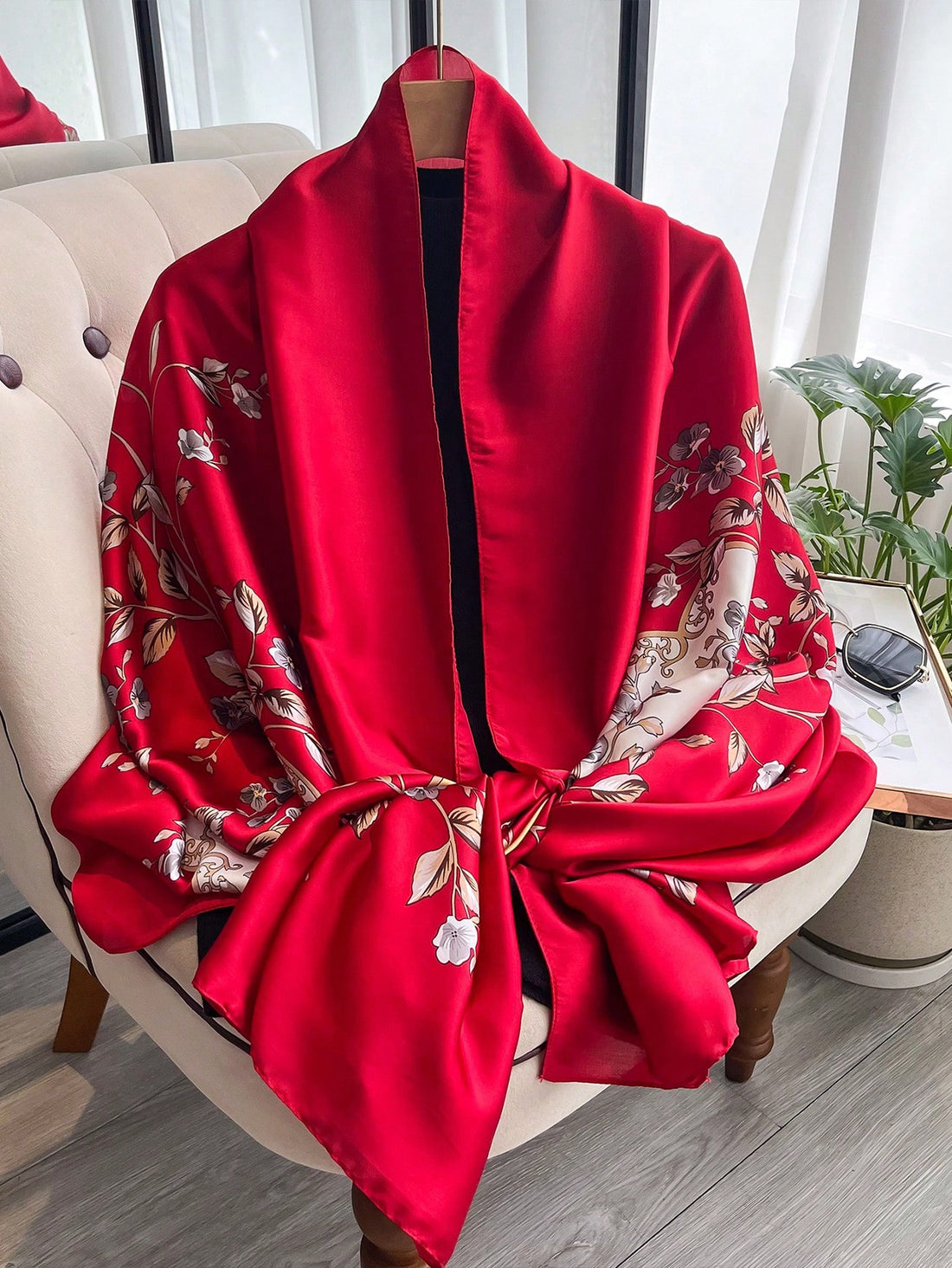 This chic floral printed scarf is the perfect accessory for beach vacations and sun protection. Made with imitation silk, it not only adds style to your outfit, but also protects your skin from harmful UV rays. Stay fashionable and protected with this versatile scarf.