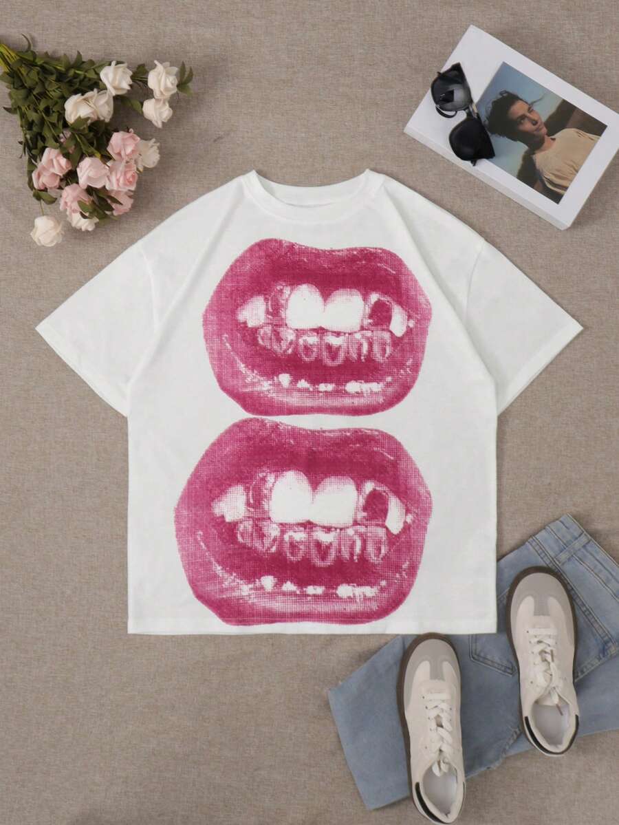 Front flat lay of white punk T-shirt with pink distressed mouth graphic and casual styling