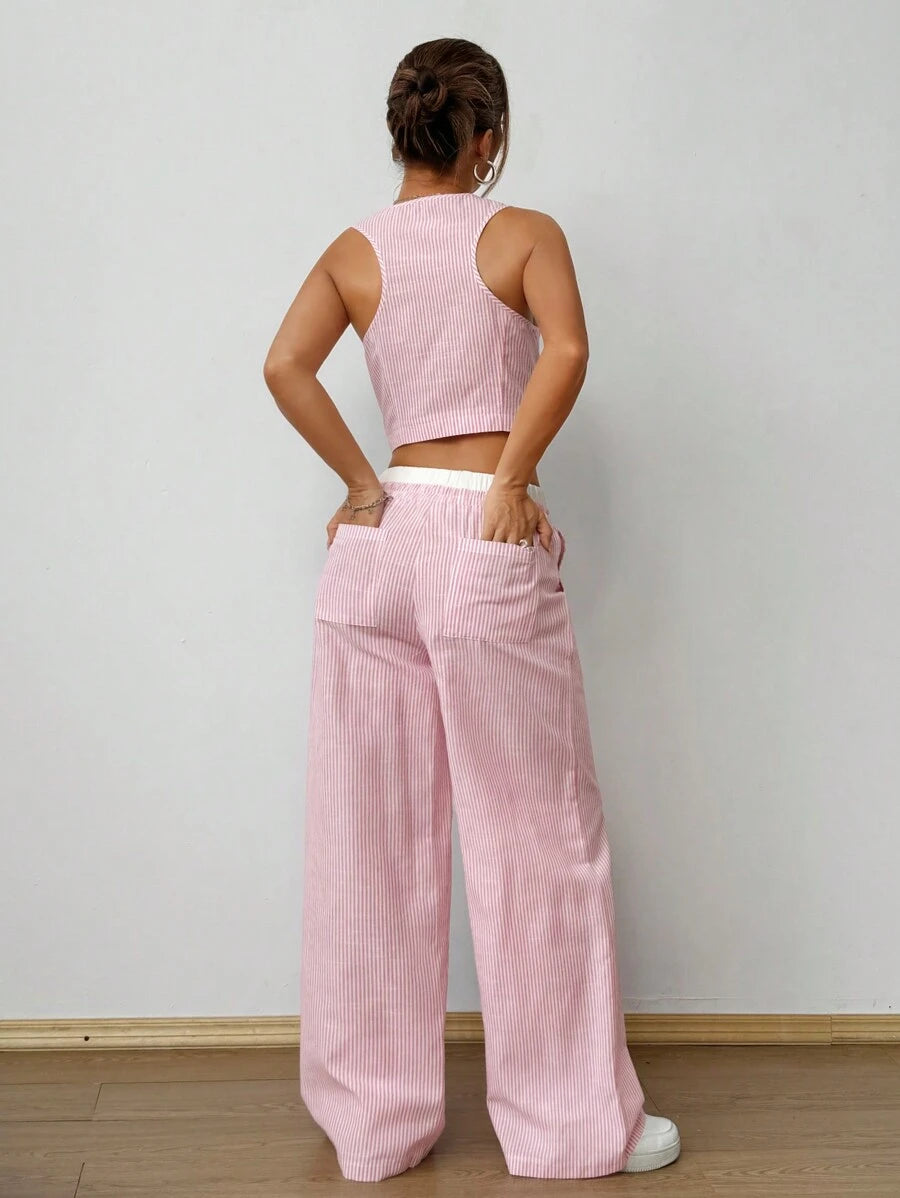 Effortlessly chic meets summer-ready with this dynamic two-piece set! The striped sleeveless top features a flattering V-neckline that's perfect for warm-weather styling, while the coordinating pants boast contrast pockets for that extra touch of personality. Mix, match, or wear together—this versatile duo transitions seamlessly from casual brunch to evening outings. Whether you're lounging poolside or heading out for adventure, you'll feel put-together and comfortable all season long.
