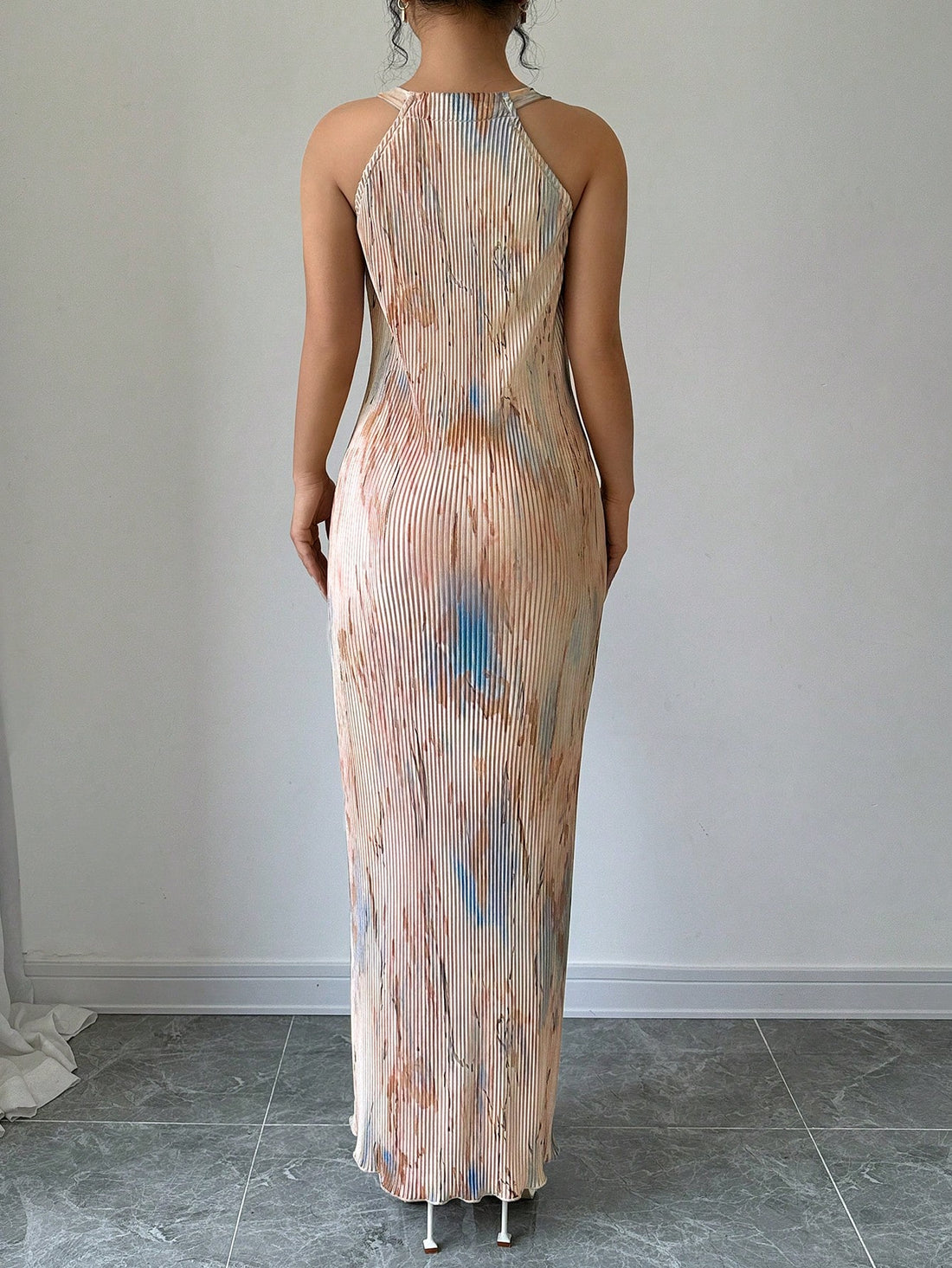 Introducing our Chic Tie-Dye Maxi Dress, featuring an elegant pleated design for effortless style. Stand out in this playful and fun dress, sure to make a statement and turn heads. Perfect for any occasion, this dress offers both style and comfort for the fashion-forward individual. Get yours now!