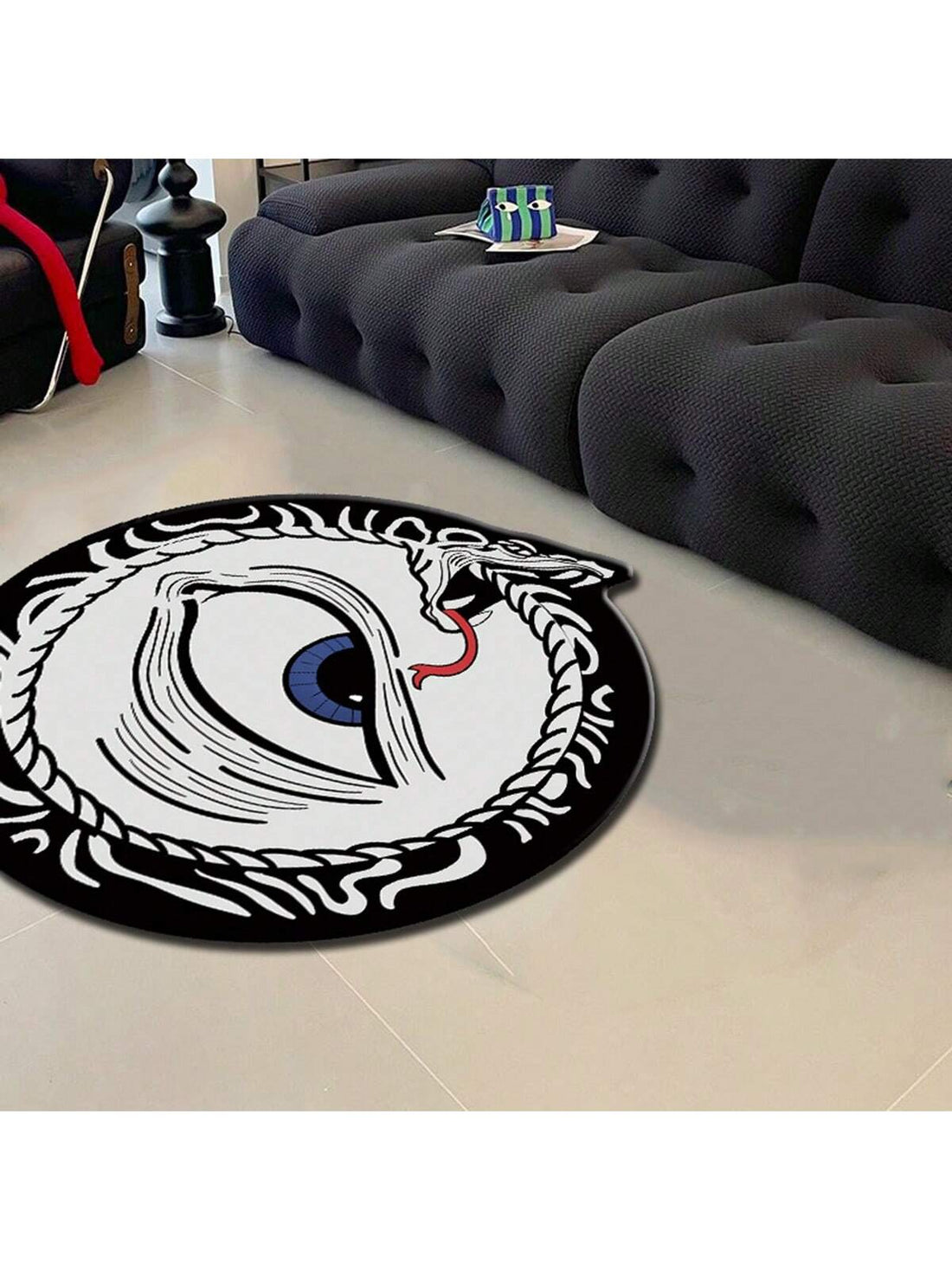 Elevate the look of your home with our Snake Eye Printed Round Carpet. Designed with a funny and eye-catching style, this decorative rug adds a unique touch to any room. Made with high-quality materials, it offers both comfort and durability. Transform your space with this must-have addition.